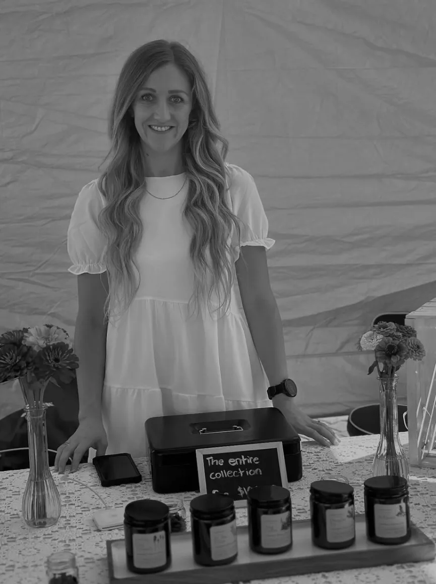 Sarah Swanson at the Woodland Candle Co market stand